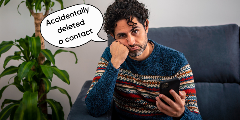 A man sitting on a couch with a speech bubble saying accidentally deleted a contact.
